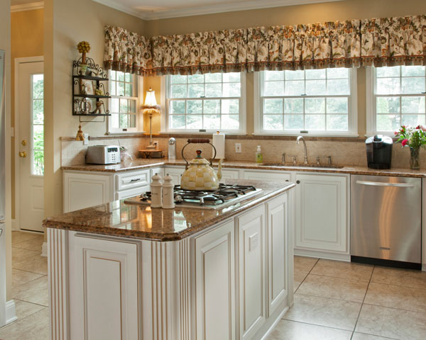 Cottage Style Kitchen with White Cabinets, Granite Countertop, and Yellow Tea Kettle