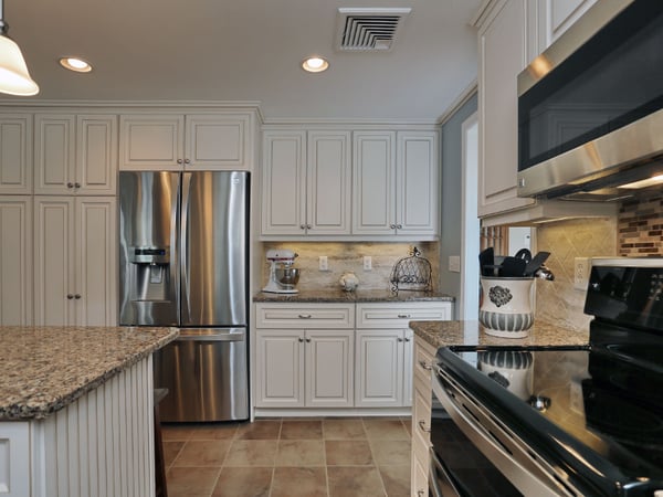 our popular antique white cabinets with walnut glaze