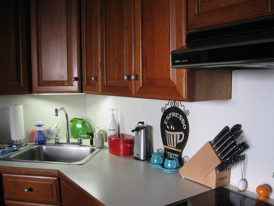 exposed light rail kitchen cabinet