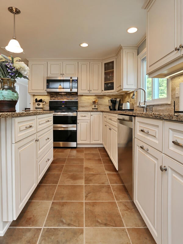 Cambria Canterbury countertops and Antique White cabinets