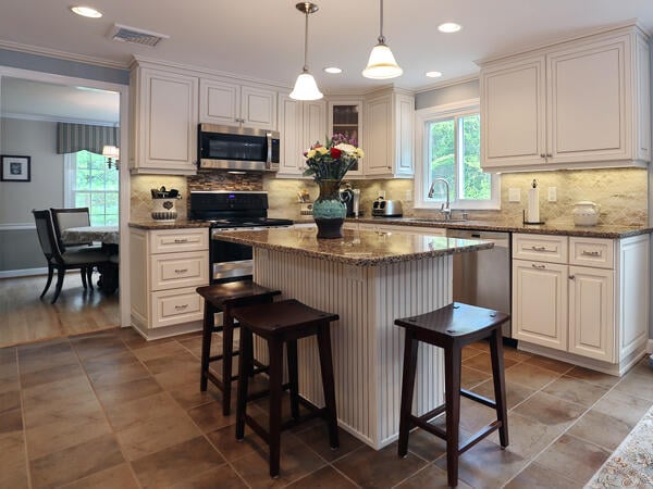 Cambria Canterbury countertop and Antique White cabinets