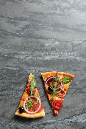 ENV- two slice of pizza on laminate countertop