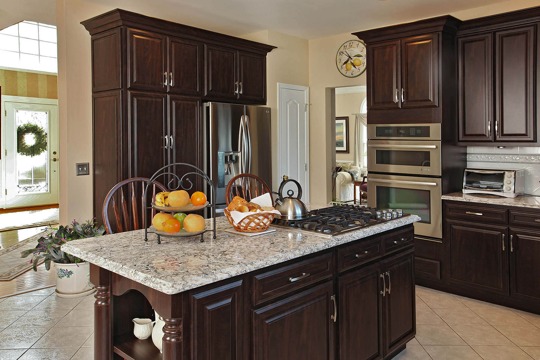 dark cabinets small kitchen        
        <figure class=