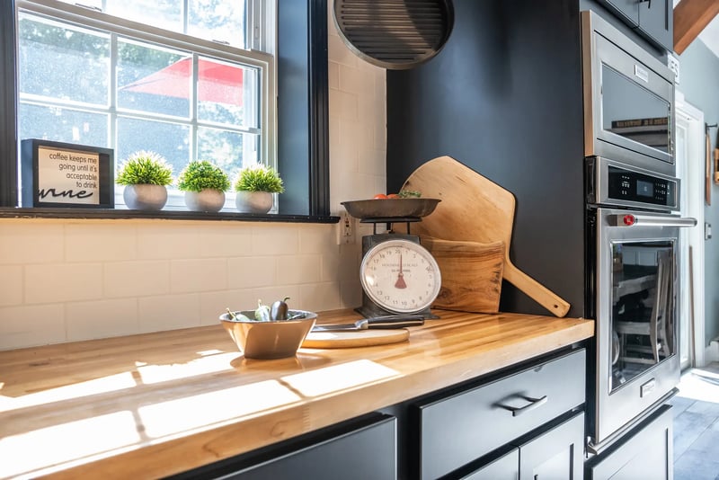 kitchen-black-cabinetry-wood-countertops
