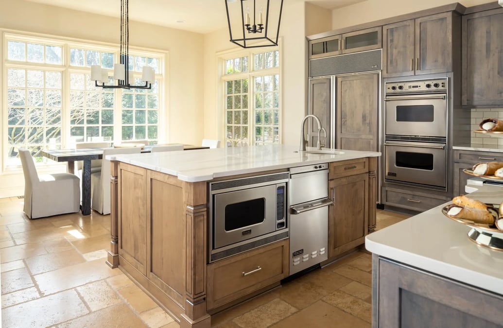 kitchen-earthy-tones-wood-cabinetry-quartz-countertops