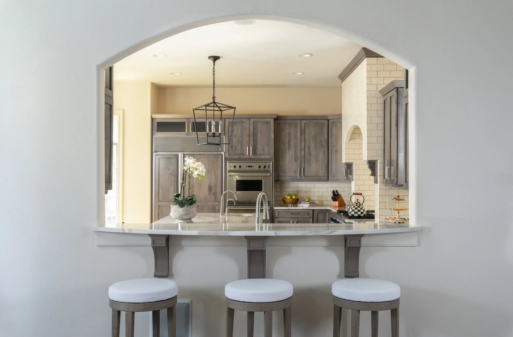kitchen-earthy-tones-wood-cabinetry-quartz-countertops