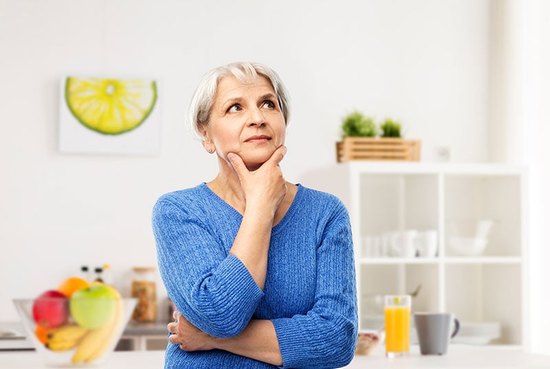 woman-thinking-in-kitchen