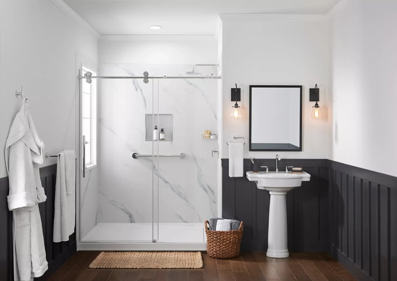 Bathroom featuring white solid surface shower area