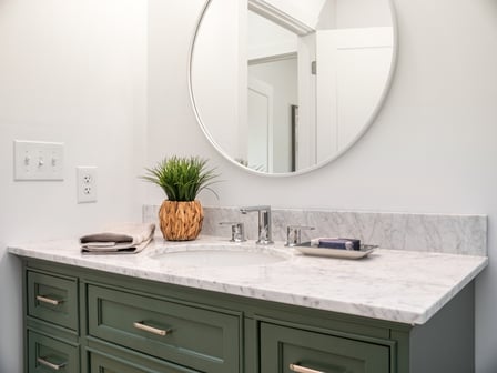 Shutterstock_white bathroom green vanity_Do Custom Vanities Add Value (ROI and Home Resale Perspective)_12 March 2026.jpeg