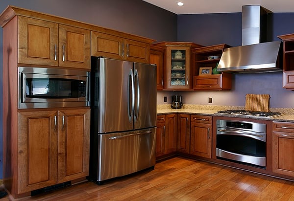 Stainless Steel French Door Drawer Fridge in a Kitchen with Wood Cabinets