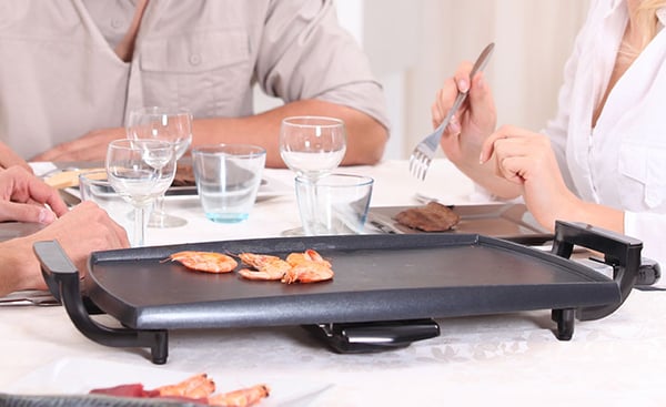 Cooking on Electric Griddle on Dining Table