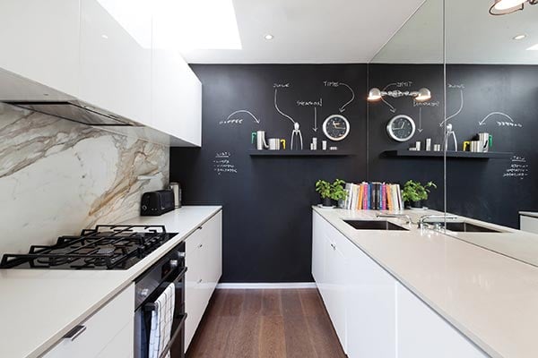 galley kitchen with chalkboard wall