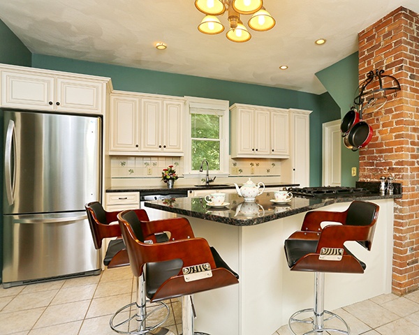 Green Kitchen with White Cabinets