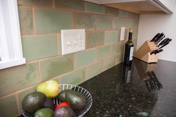 Green subway tile kitchen backsplash