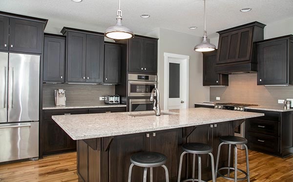 https://blog.kitchenmagic.com/hs-fs/hubfs/blog-files/home-dark-kitchen-cabinet-design.jpg?width=600&name=home-dark-kitchen-cabinet-design.jpg