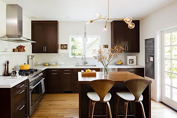 Stylish kitchen with brass pendant