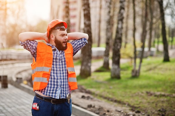 Contractor Yawning and Walking Away From the Job