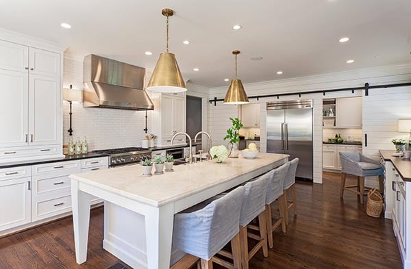 Farmhouse kitchen with brass pendants