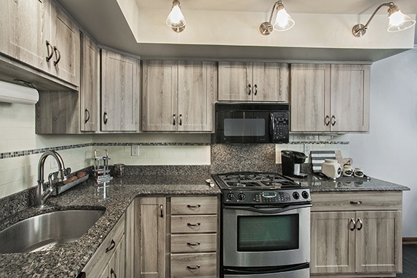 To Soffit Or Not That Is The Kitchen Cabinet Question Barnwood Cabinets With Lighting Mounted To The Soffit