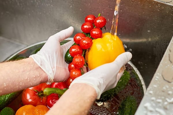 washing vegetabls in the kitchen sink