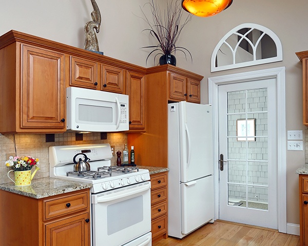 Wood Cabinet Kitchen with White Appliances and Accents