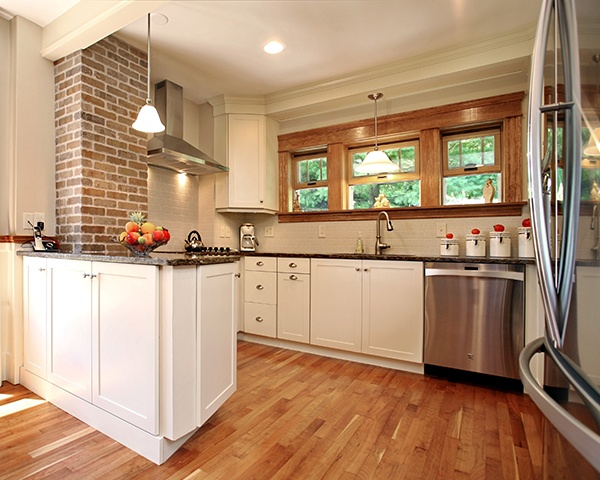 Kitchen with White Cabinets with Warm Colored Details