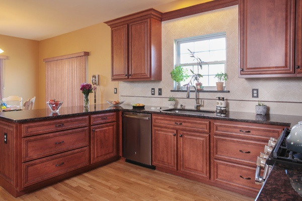 Cherry Kitchen Cabinets and Black Granite Countertop