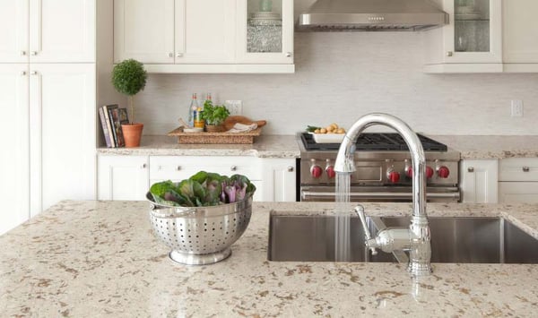 Natural color quartz countertop with white cabinets