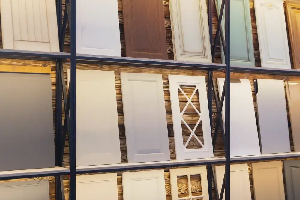 kitchen cabinet and furniture samples displayed in a remodeling showroom