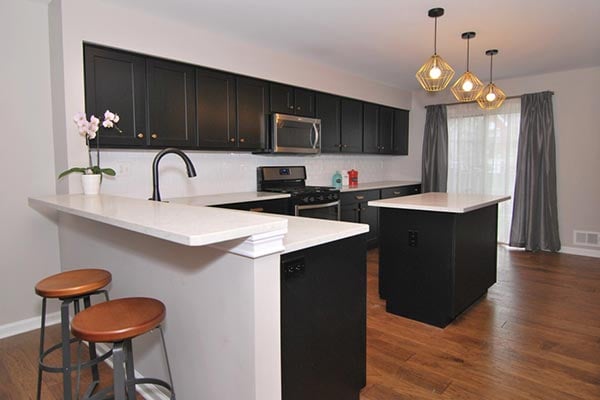 Black Kitchen Cabinets with White Backsplash