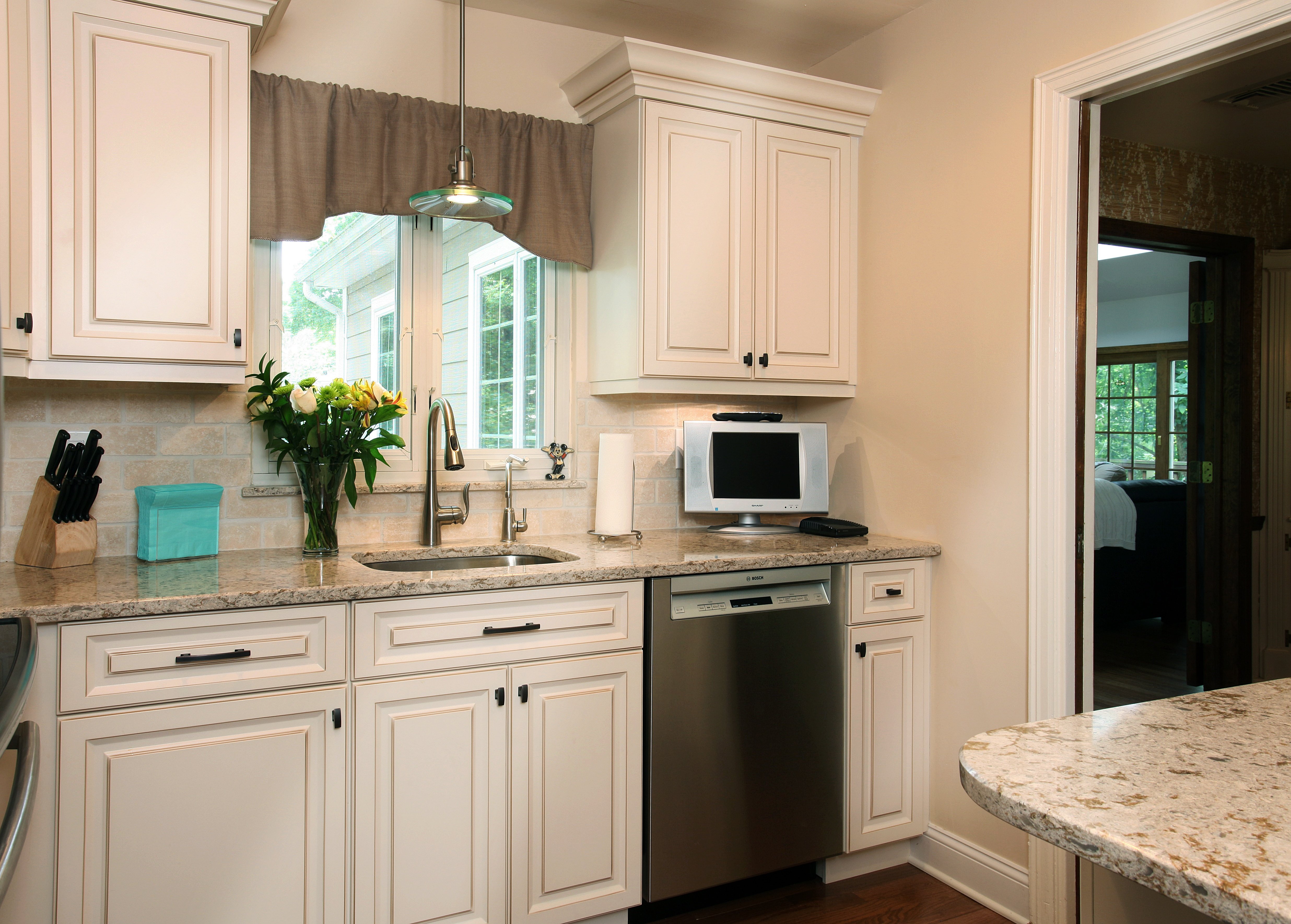 antique white and walnut glaze cabinets